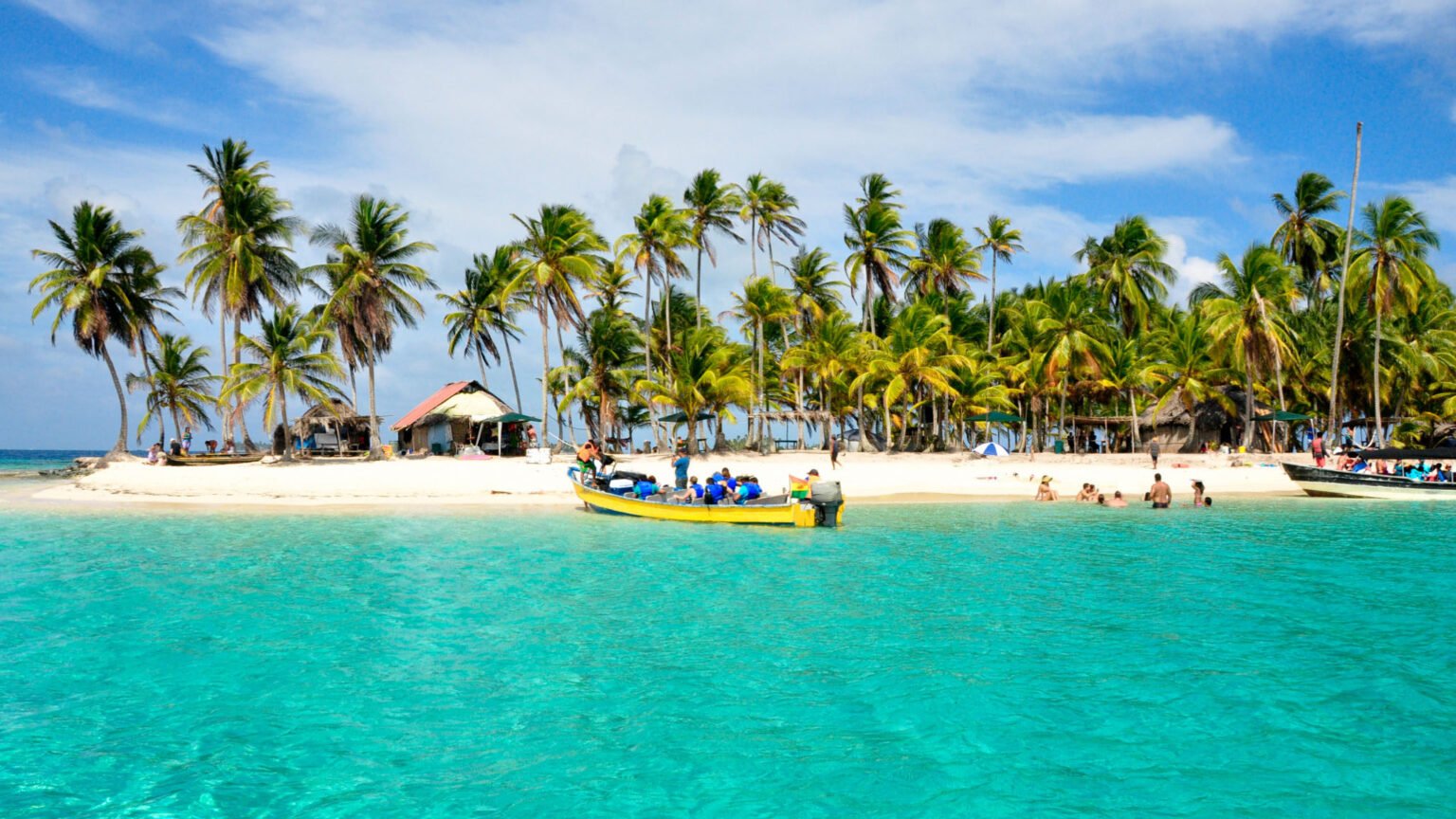 Tropical beach with palm trees and boat