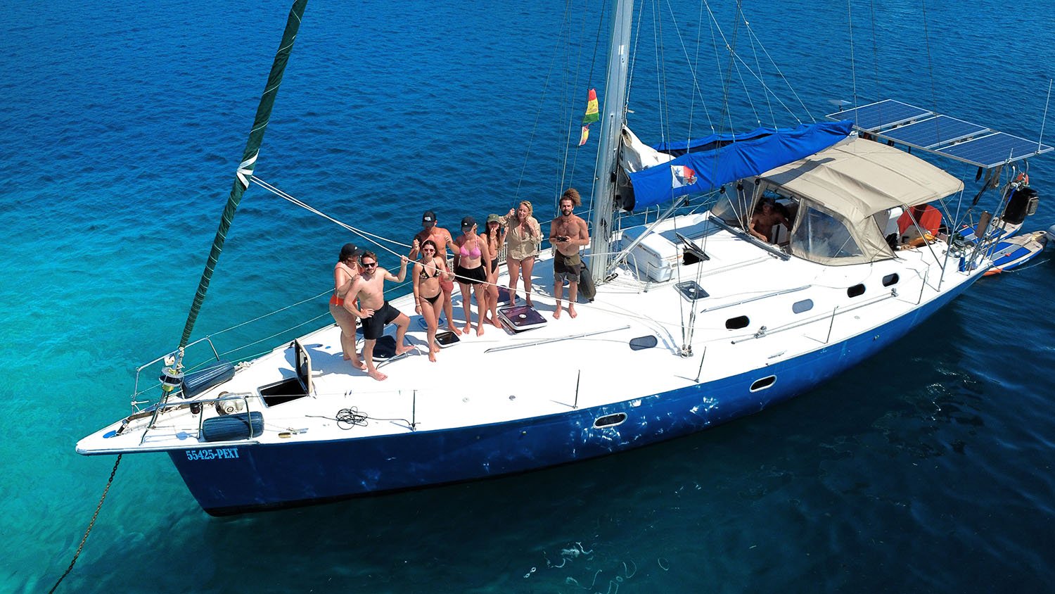 Group of people on a sailboat.