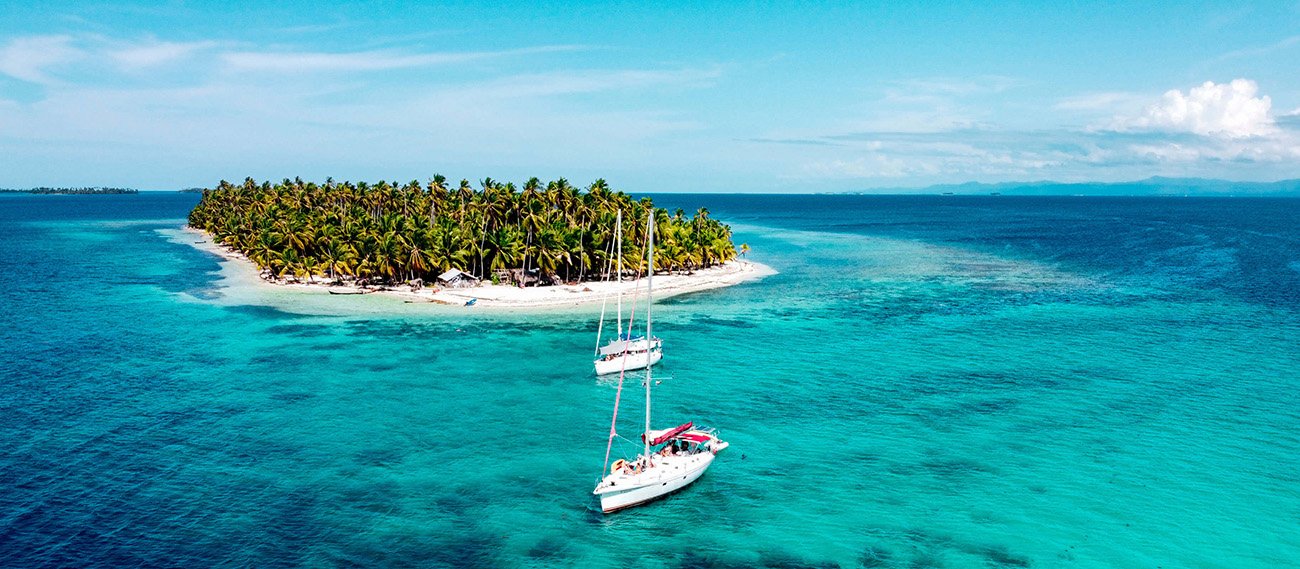 Sailboat anchored by a remote San Blas island in Panama
